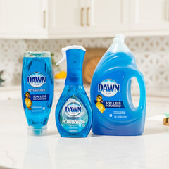 Three bottles of Dawn dish soap on a kitchen counter.