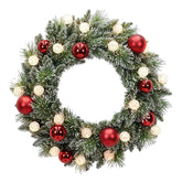 Christmas wreath with red and gold ornaments on a white background