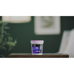 Drydex container on a wooden surface with a blurred indoor background
