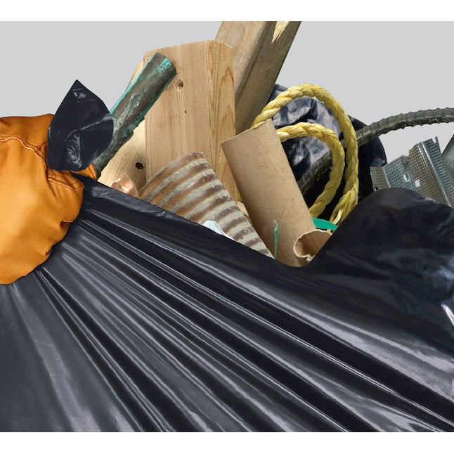 Black trash bag filled with various items including a wooden stick, cardboard box, and plastic bag.